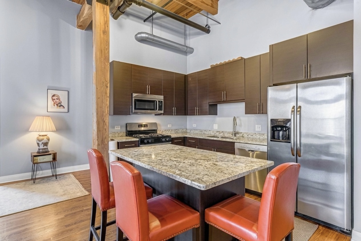 Kitchen — granite island & timber beam