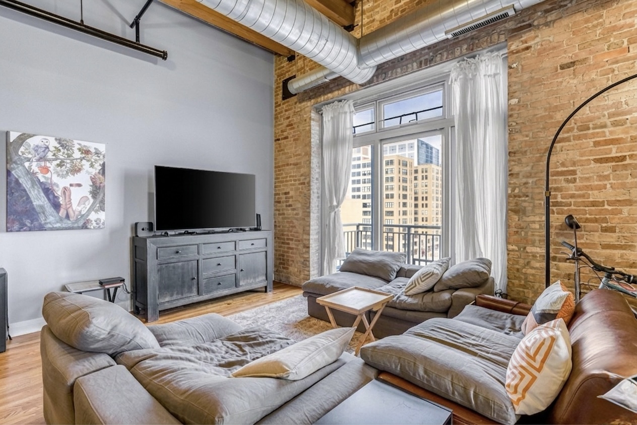 Living room — brick wall & city views